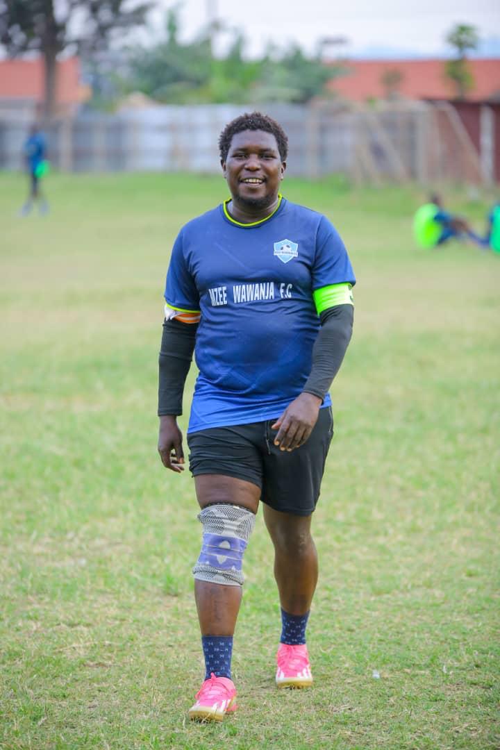 Mzee Wawanja captain walking on the football pitch
