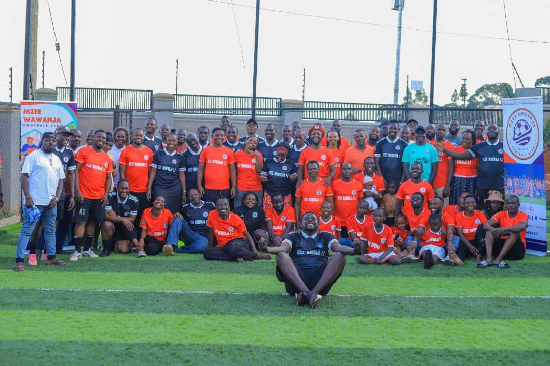 Mzee Wawanja players, families and supporters posing together