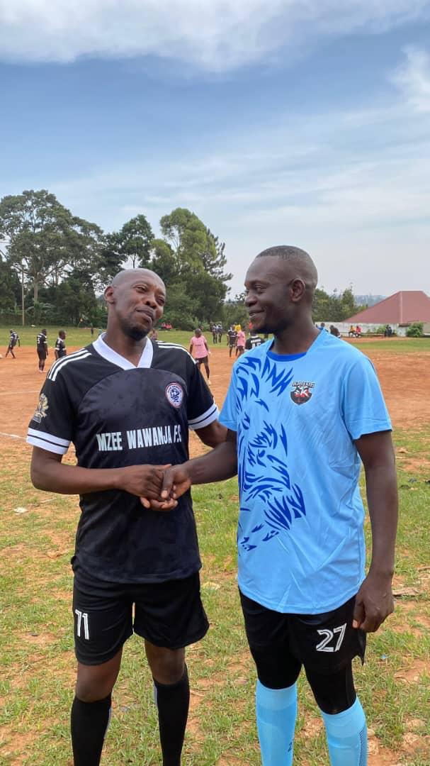 Two football players shaking hands after a match