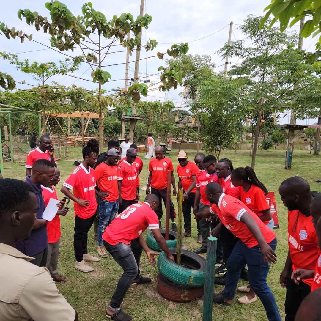 Club members gathering around a team-building challenge