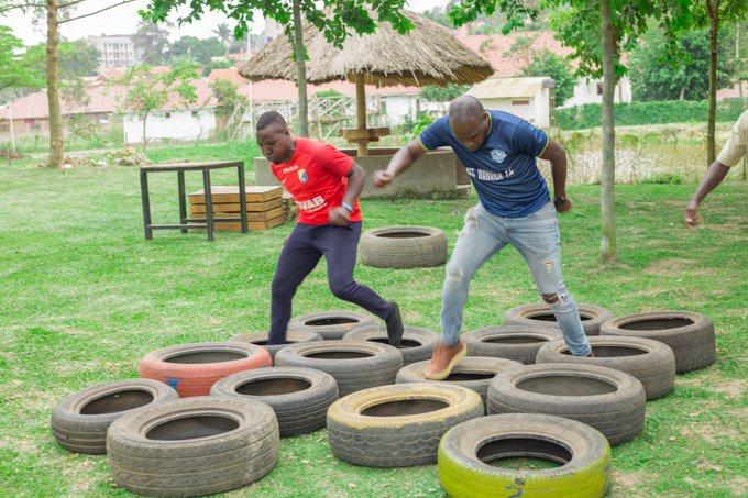 Club members taking part in a tyre obstacle challenge