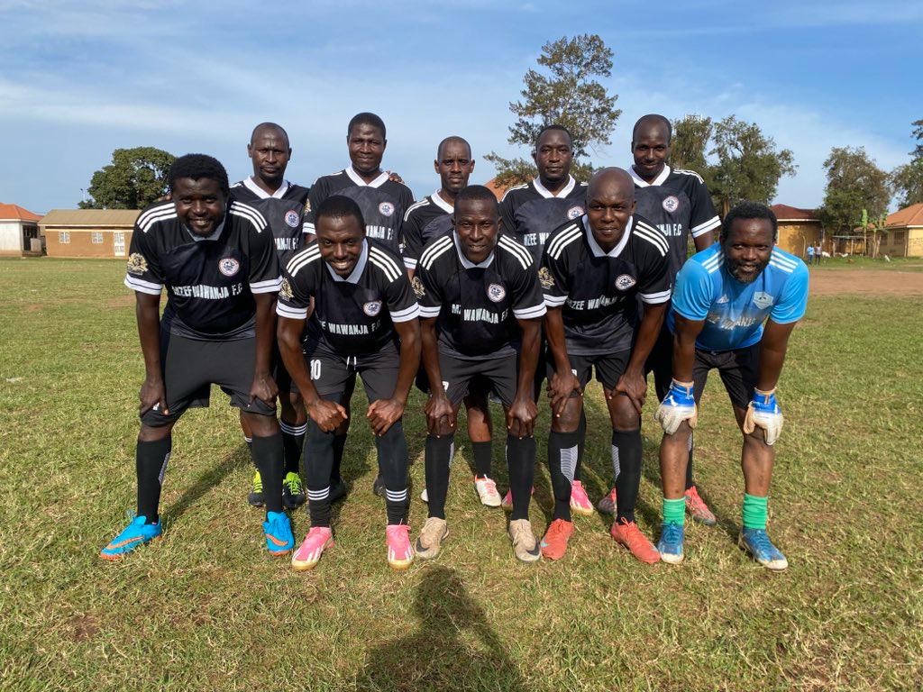 Mzee Wawanja starting team posing before a match
